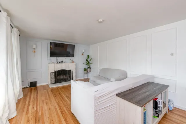 a bedroom with a bed and a fireplace