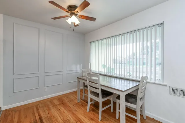 a dining room with furniture and window