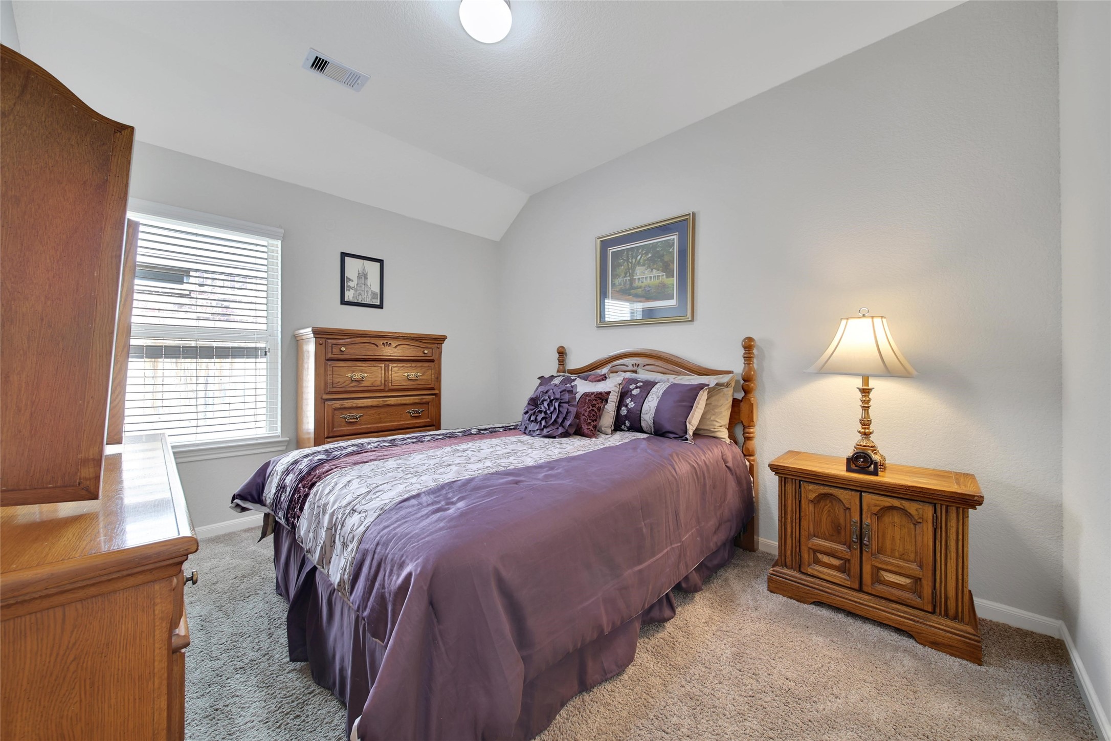 214 Pleasant Hill Way Conroe, TX 77304 - Photo 25 of 43 The second of three bedrooms is spacious and bright with generous closet space.