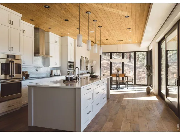 a open kitchen with stainless steel appliances granite countertop a sink and cabinets