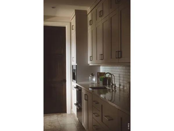 a view of a kitchen with a sink