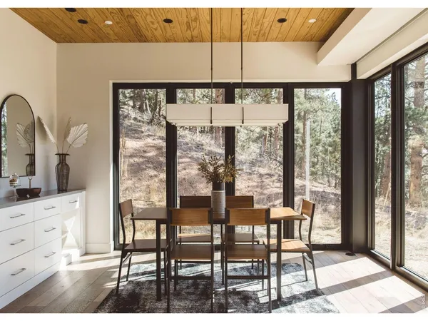 a view of a dining room with furniture window and outside view
