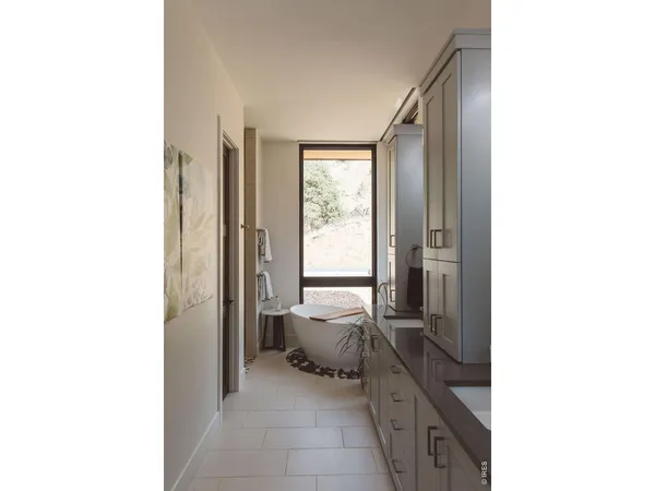 a en suite bathroom with a sink and a mirror