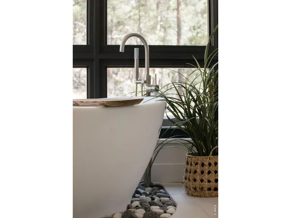 a picture of a bathroom with a sink and mirror