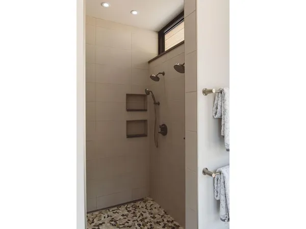 a bathroom with a shower and a sink