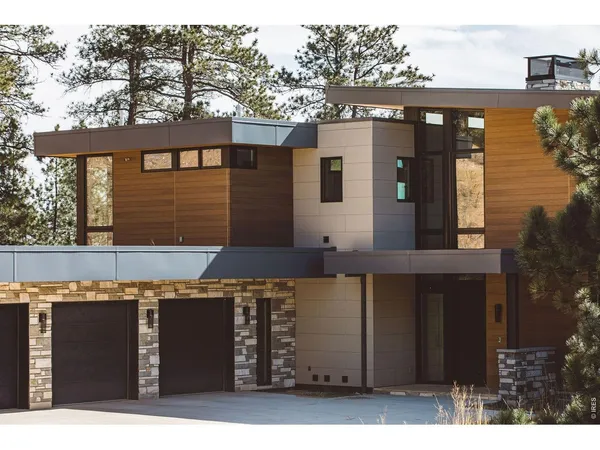 a front view of a house with parking