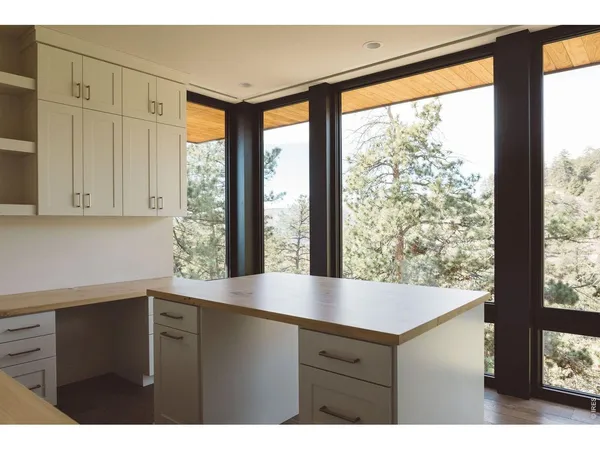 a kitchen with a large window
