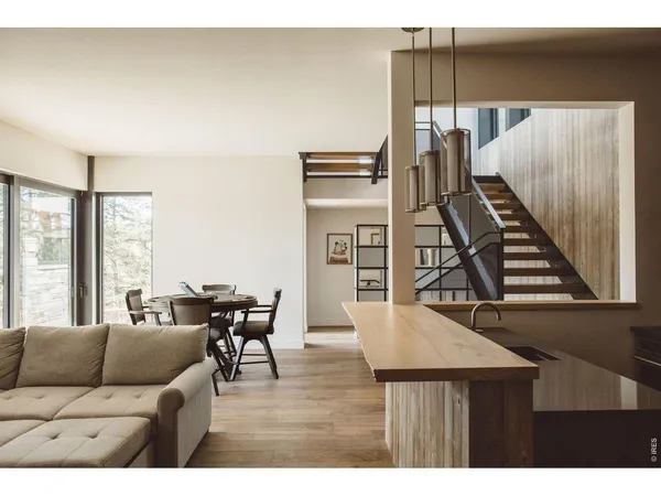a living room with furniture and a piano