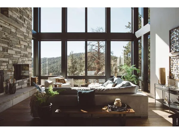 a floor to ceiling window with chairs and table