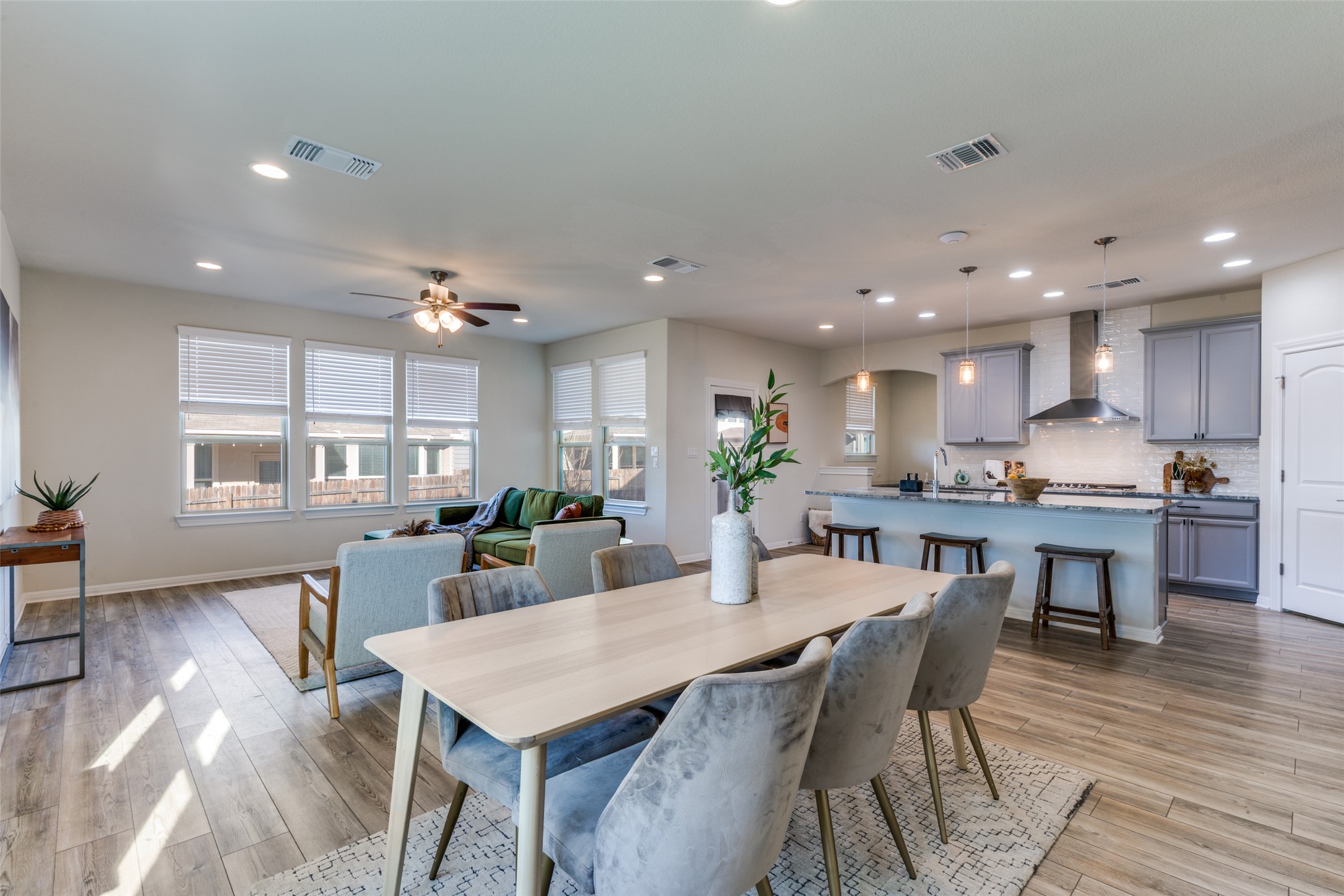 3208 Maysillee Street Austin, TX 78728 - Photo 4 of 23 Dining area featuring a ceiling fan, light wood finished floors, and recessed lighting