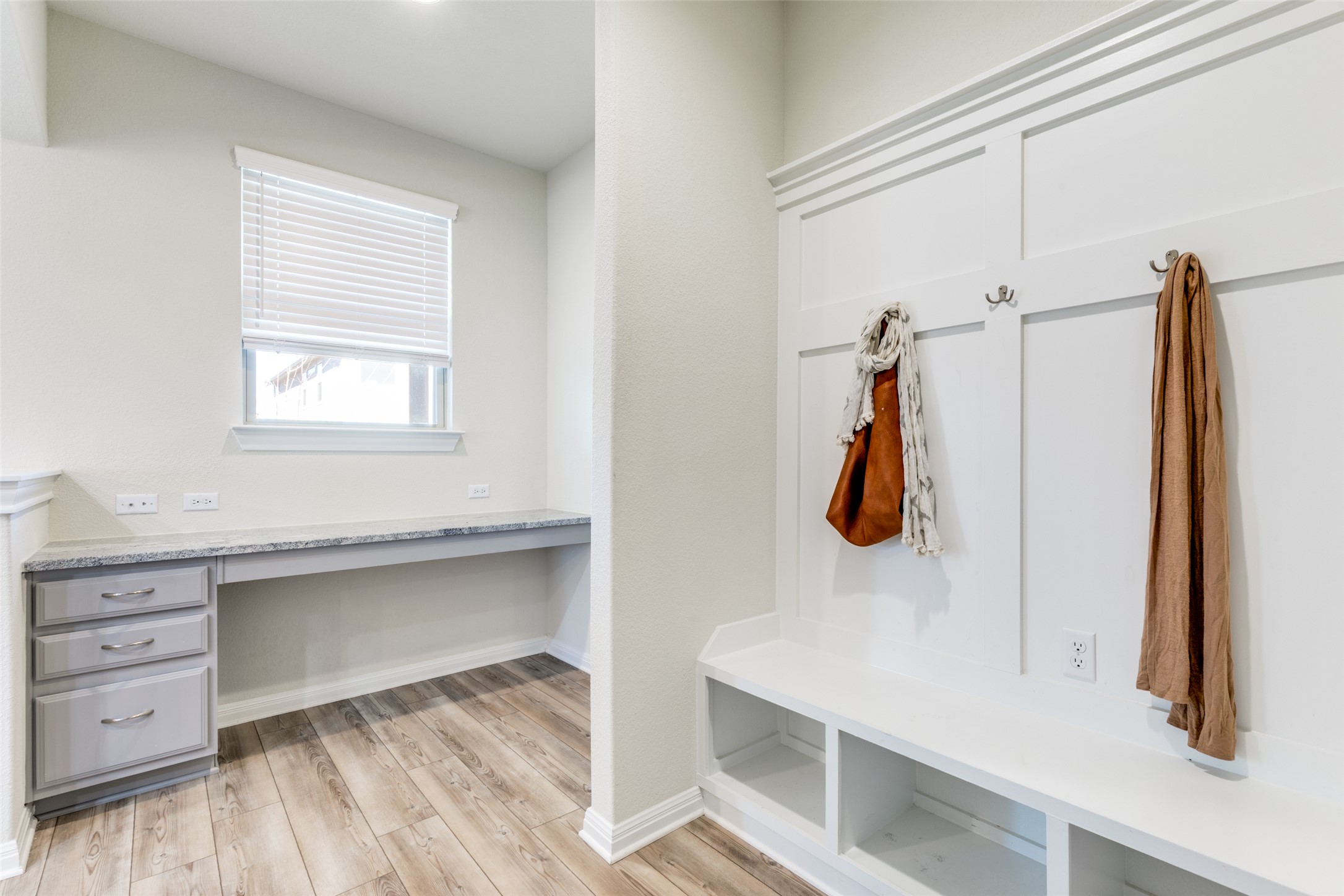 3208 Maysillee Street Austin, TX 78728 - Photo 7 of 23 Mudroom featuring built in study area and light wood-style flooring