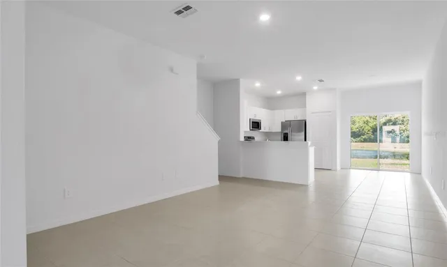a kitchen with stainless steel appliances granite countertop a stove and a microwave