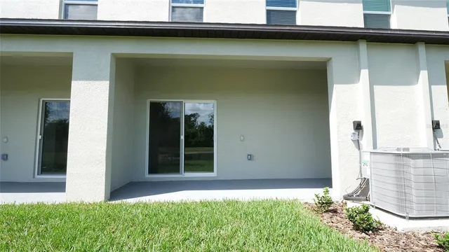 an aerial view of a house with a swimming pool
