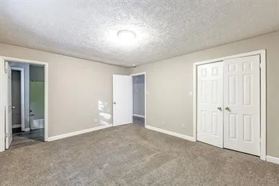 an empty room with closet area