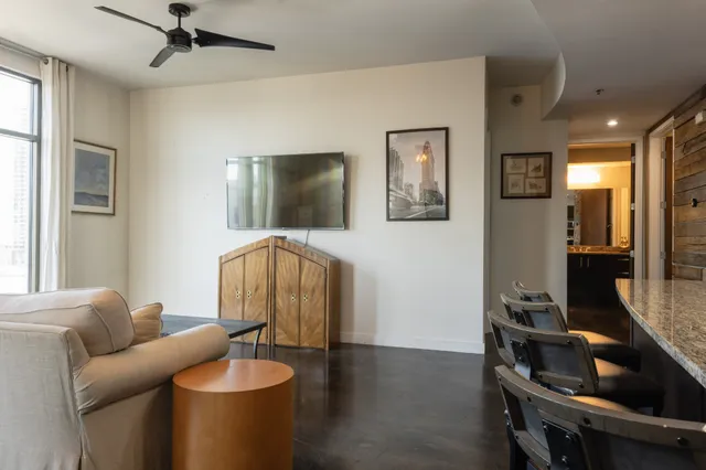 a living room with furniture and a flat screen tv