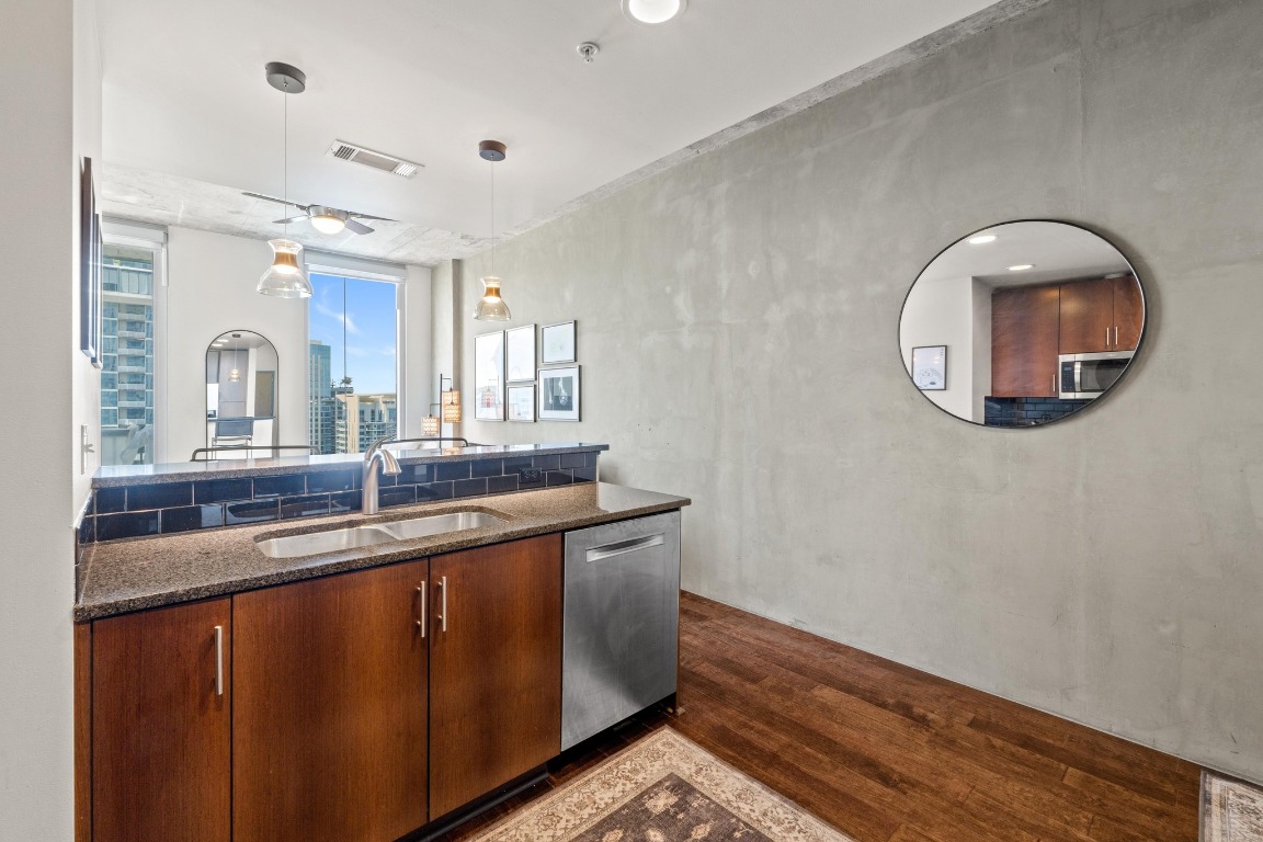 360 Nueces Street, Unit 2808 Austin, TX 78701 - Photo 11 of 29 a bathroom with a granite countertop sink and a mirror