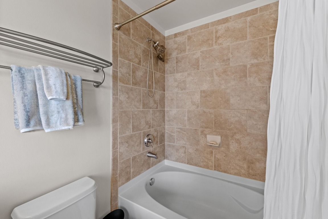 360 Nueces Street, Unit 2808 Austin, TX 78701 - Photo 17 of 29 a bathroom with a shower and toilet