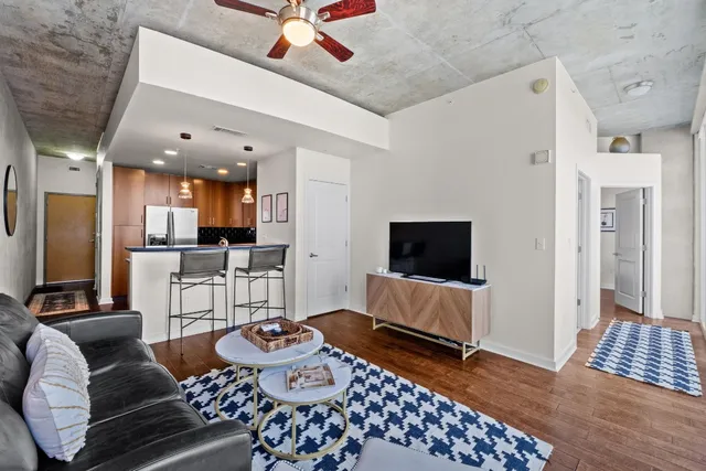 a living room with furniture and a flat screen tv