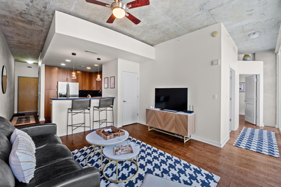 360 Nueces Street, Unit 2808 Austin, TX 78701 - Photo 4 of 29 a living room with furniture and a flat screen tv