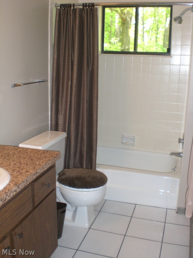 4983 Harris Road Broadview Heights, OH 44147 - Photo 15 of 25 MAIN FLOOR BATHROOM WITH NEWER COUNTER TOP AND CERAMIC TILE FLOORING