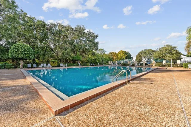 a view of swimming pool with a yard