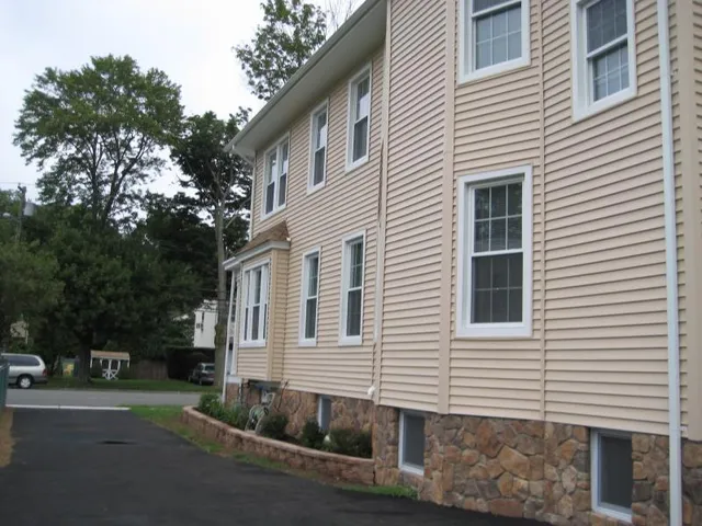 a view of a house with a yard