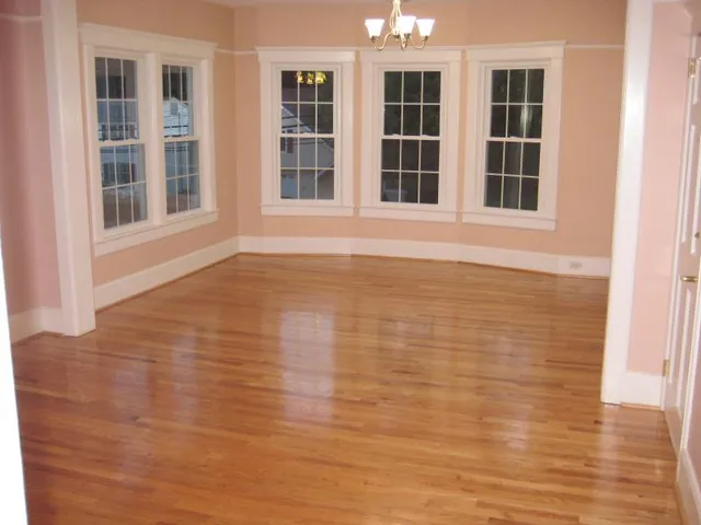 a kitchen with granite countertop a stove and a microwave with cabinets
