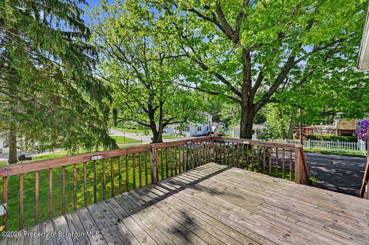 502 Layton Road Clarks Summit, PA 18411 - Photo 20 of 42 a view of balcony with wooden floor and fence