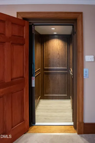 a view of empty room with a fireplace