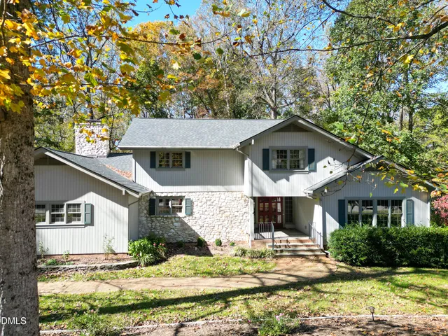 a view of a back yard of the house and a street view