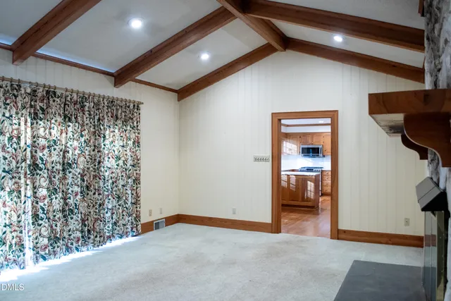 a view of an empty room and window