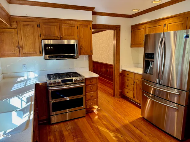 a view of a walk in closet and bathroom