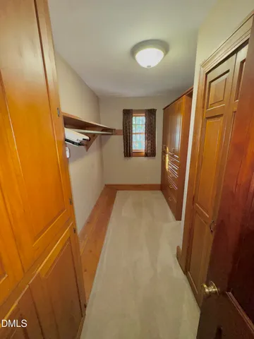 a view of a hallway with staircase