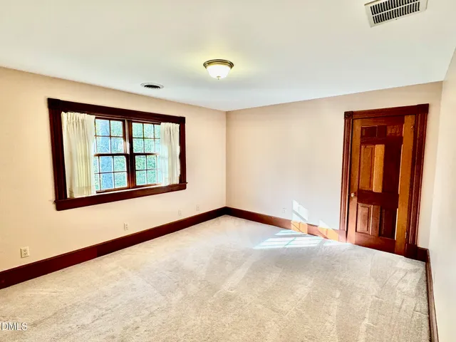 a view of walk in closet with wooden floor