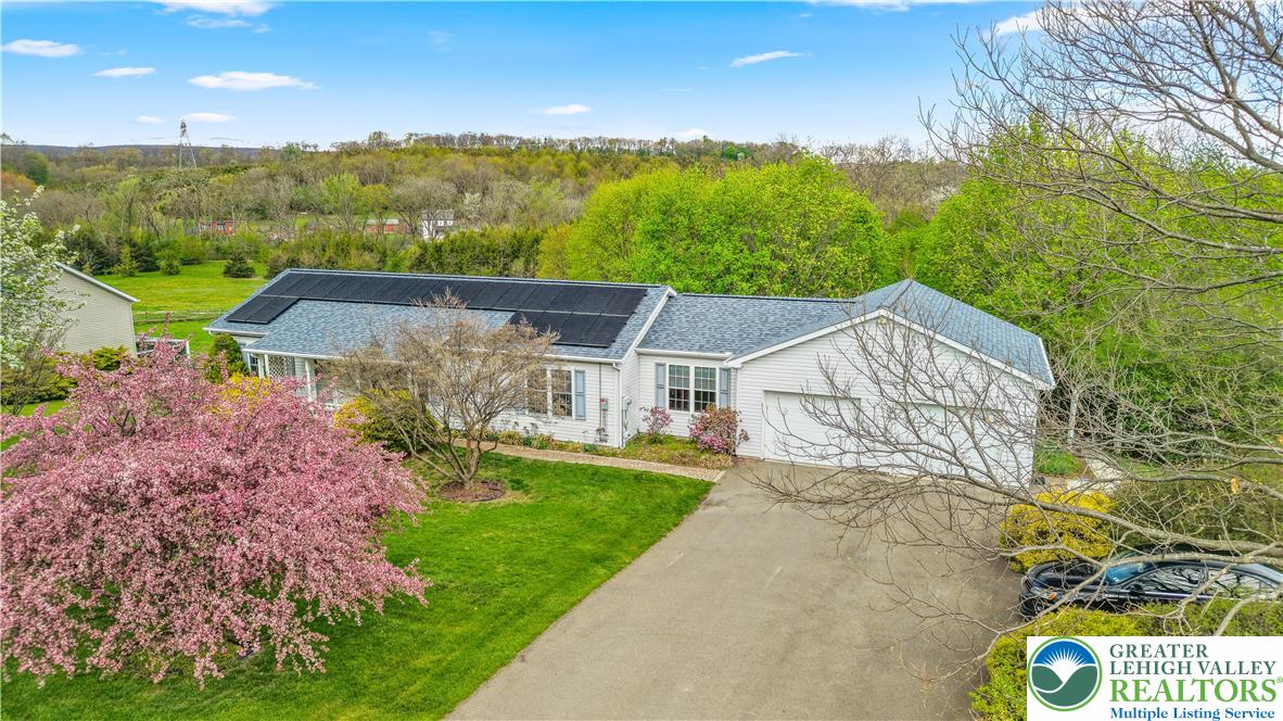540 Bauer Road Bath, PA 18014 - Photo 1 of 50 a view of a big house with a big yard and large tree