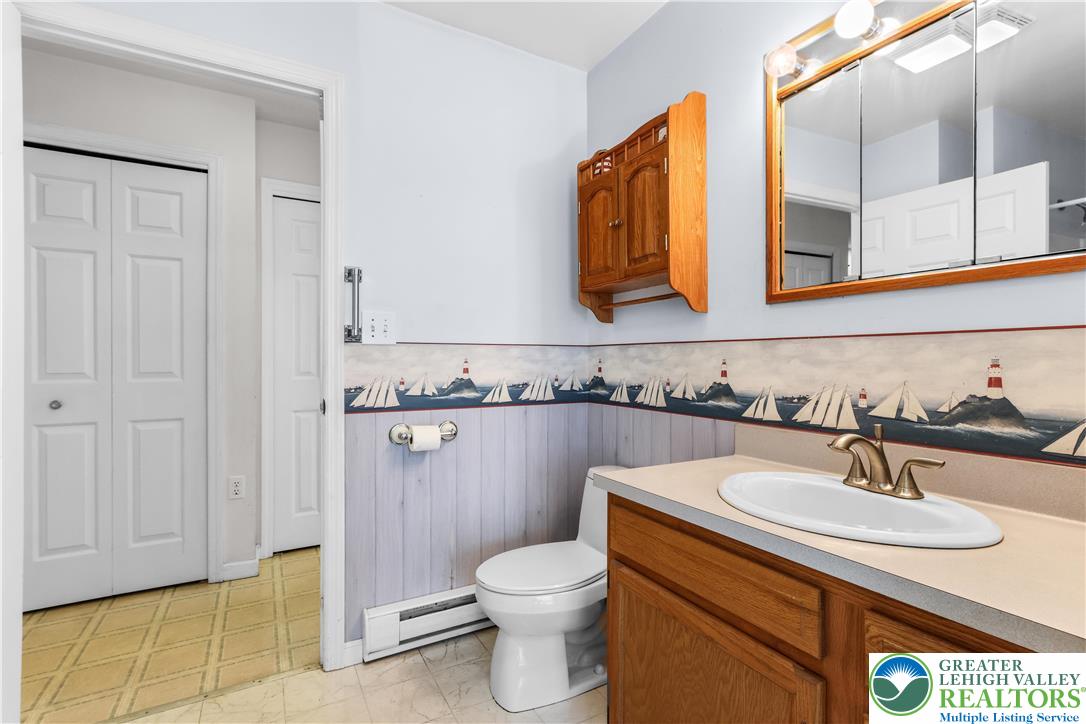 540 Bauer Road Bath, PA 18014 - Photo 28 of 50 a bathroom with a sink a toilet and mirror
