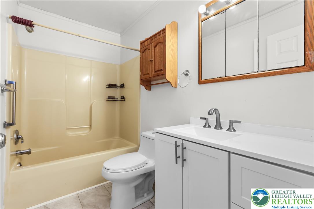 540 Bauer Road Bath, PA 18014 - Photo 33 of 50 a bathroom with a sink a toilet and shower