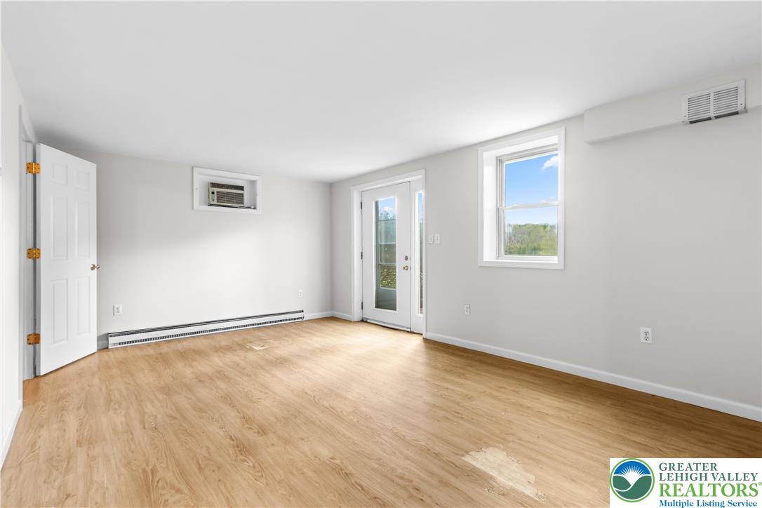 540 Bauer Road Bath, PA 18014 - Photo 35 of 50 a view of an empty room with wooden floor and a window