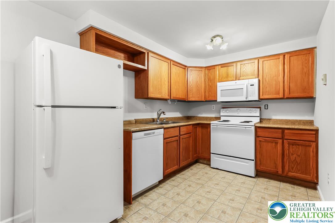 540 Bauer Road Bath, PA 18014 - Photo 37 of 50 a kitchen with a refrigerator sink and cabinets