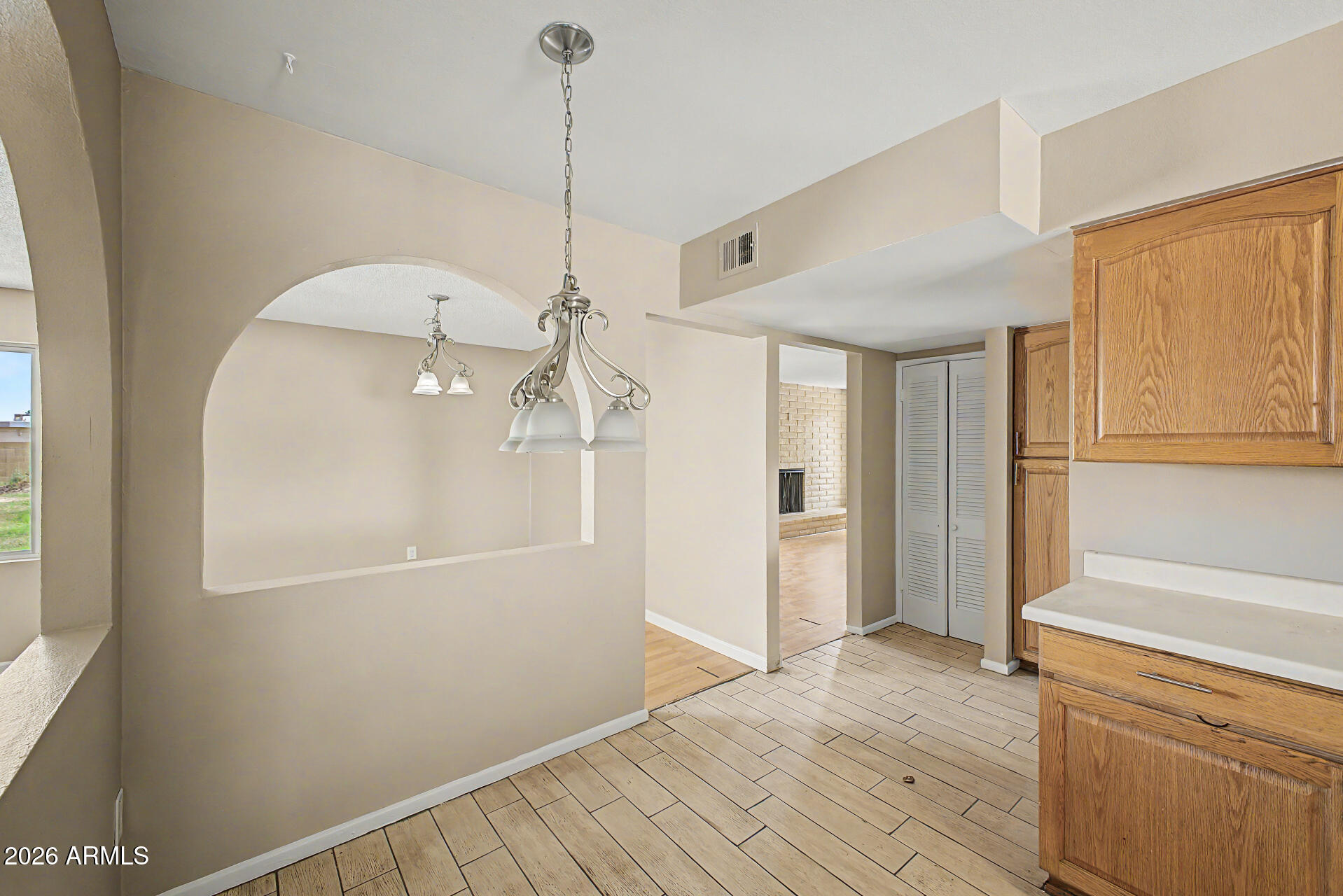 4007 West Mountain View Road Phoenix, AZ 85051 - Photo 15 of 31 a view of empty room with wooden floor and fan
