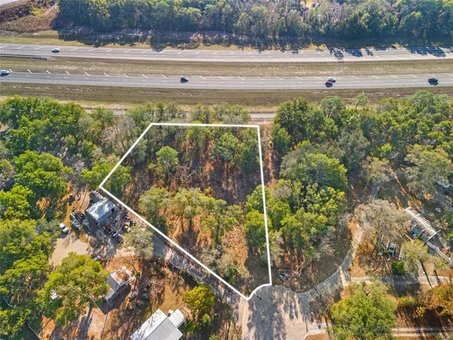 a view of outdoor space with lots of trees