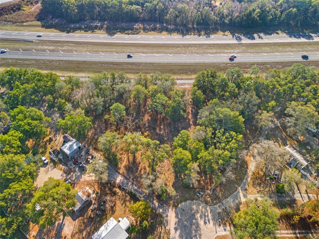 16800 Delft Place Spring Hill, FL 34610 - Photo 15 of 15 a view of outdoor space with lots of trees