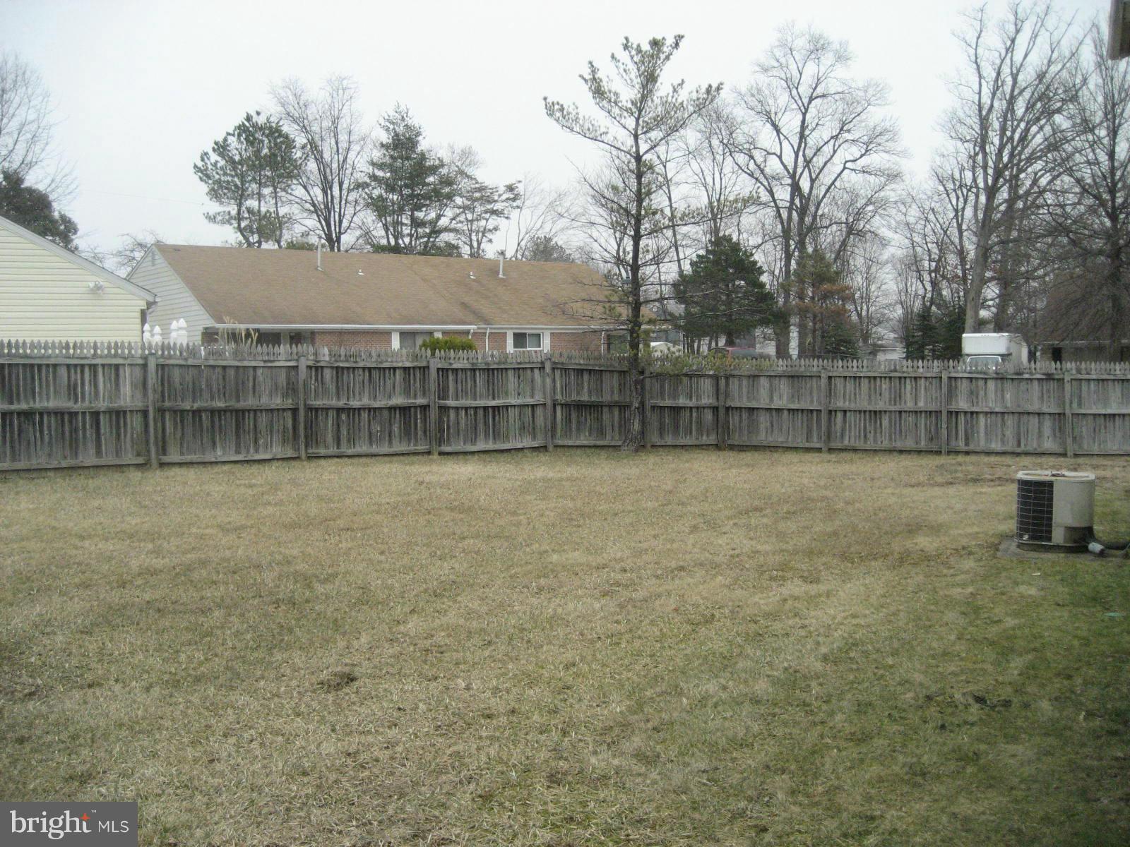 8820 Winterbrook Road Randallstown, MD 21133 - Photo 4 of 21 a view of a backyard with a fence