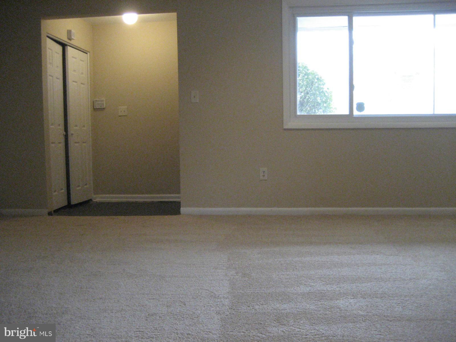 8820 Winterbrook Road Randallstown, MD 21133 - Photo 8 of 21 a view of an empty room with a window