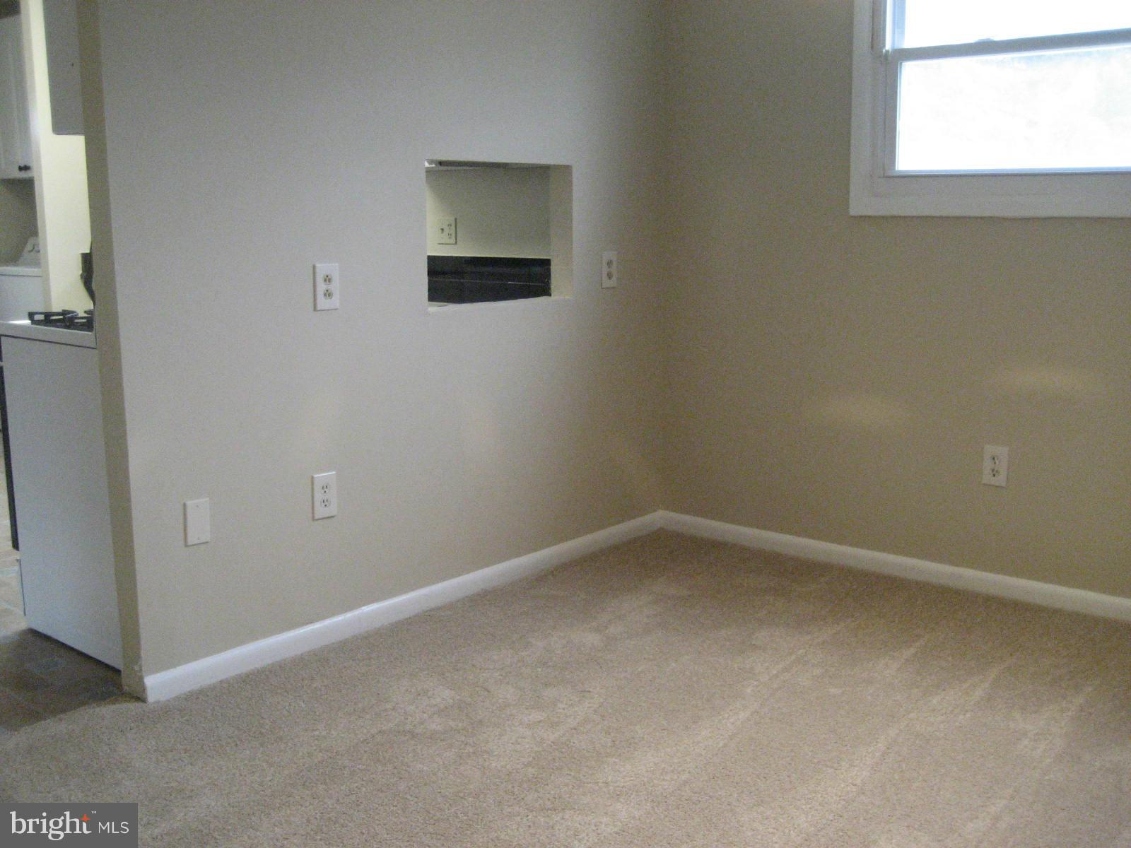 8820 Winterbrook Road Randallstown, MD 21133 - Photo 10 of 21 an empty room with a window