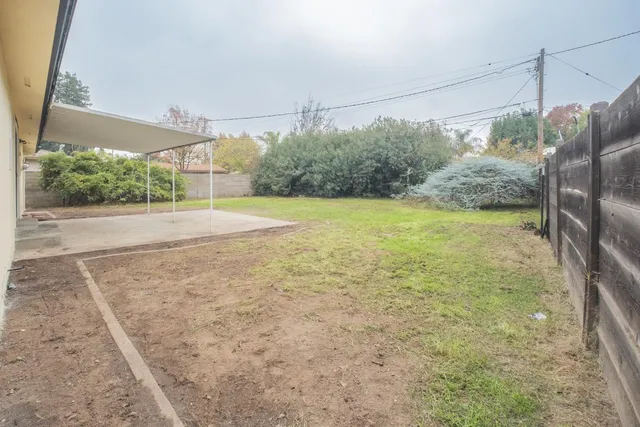 a view of a yard with wooden floor
