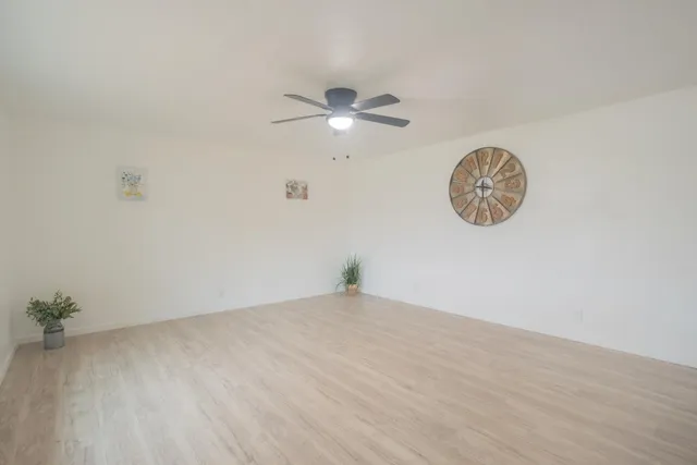 a view of a big room with wooden floor