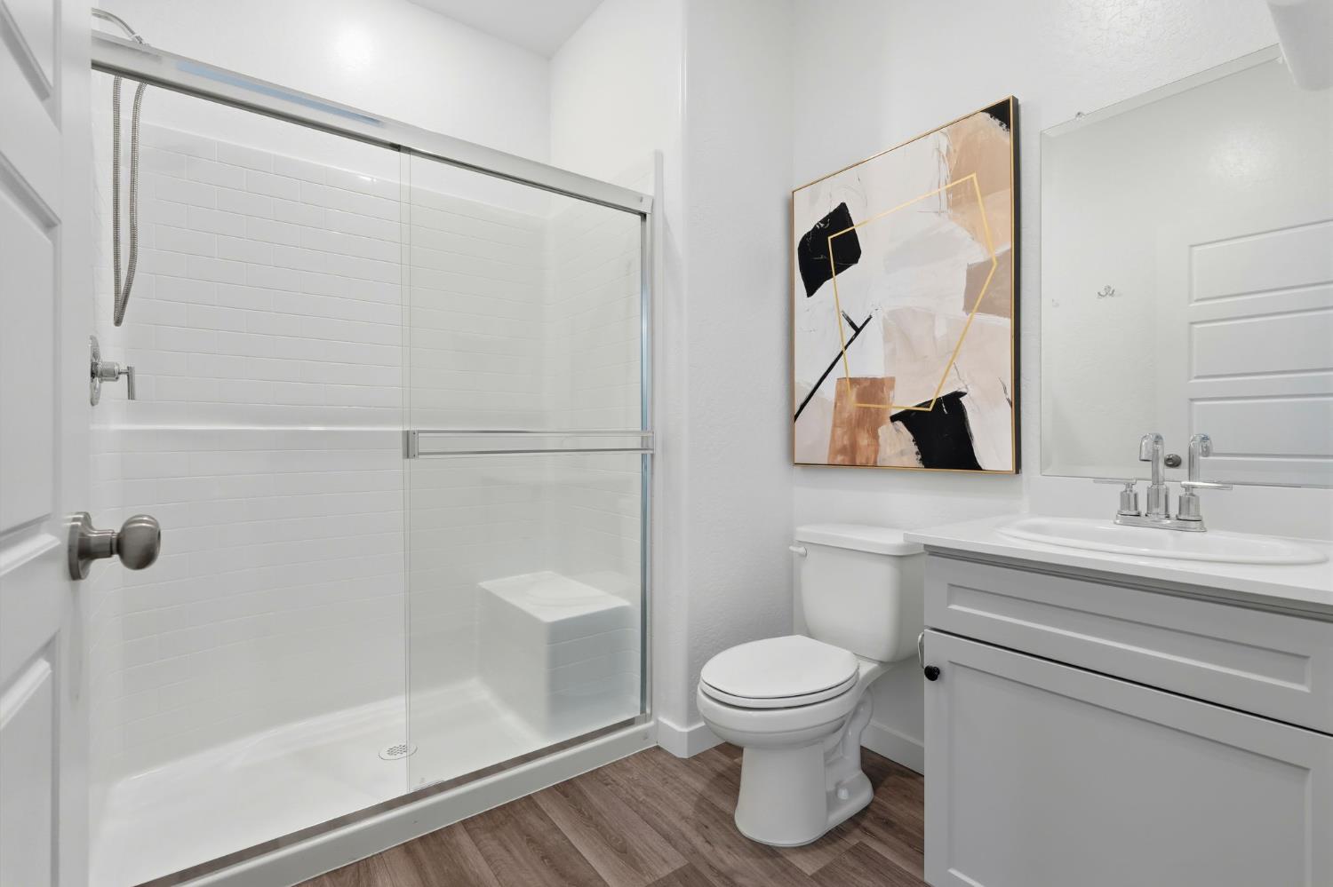 4225 Hampton Way Clovis, CA 93619 - Photo 18 of 37 a bathroom with a toilet sink and shower