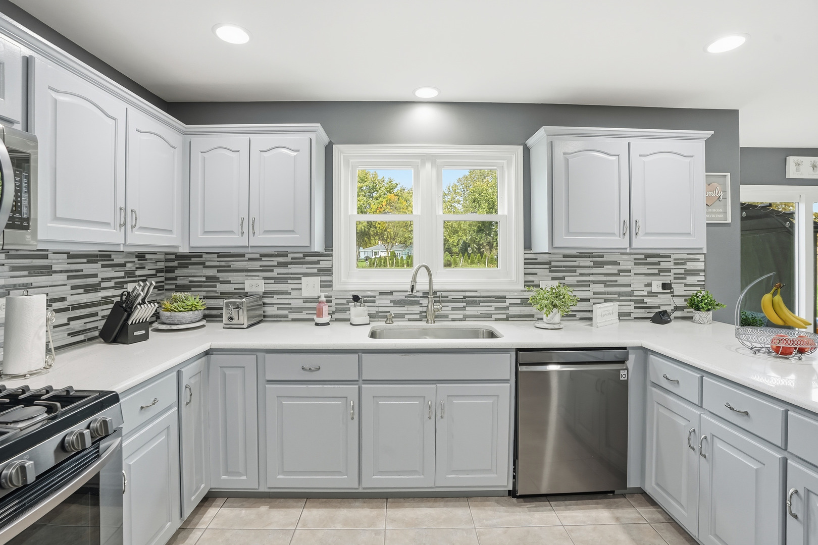 11254 192nd Street Mokena, IL 60448 - Photo 11 of 48 a kitchen with white cabinets sink and appliances
