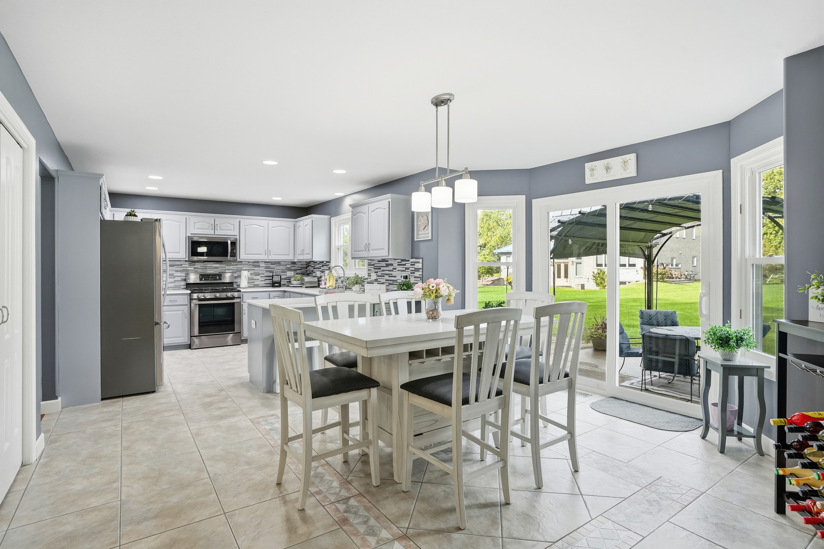 11254 192nd Street Mokena, IL 60448 - Photo 14 of 48 a dining room with furniture a chandelier and kitchen view